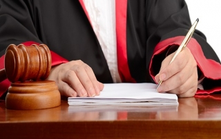 Female judge writing the verdict isolated on white background